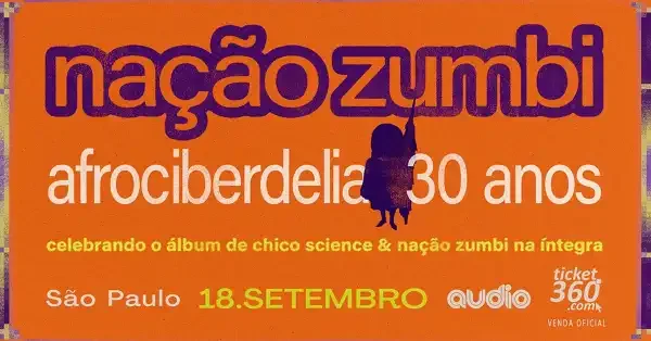 Banda Nação Zumbi apresentando show ao vivo em São Paulo, com músicos em um palco iluminado.