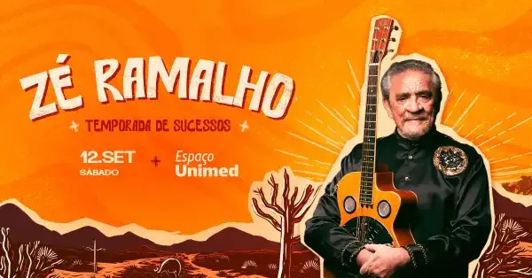 Zé Ramalho no palco em São Paulo, durante a turnê Temporada de Sucessos, segurando um violão sob luzes de show.